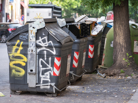 garbage bin full of trash on the street in Rome in Italy