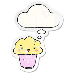 cartoon cupcake with face and thought bubble as a distressed worn sticker