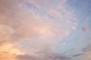 the sky with gentle clouds of pink shade, colored by the setting sun.