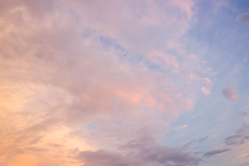 the sky with gentle clouds of pink shade, colored by the setting sun.