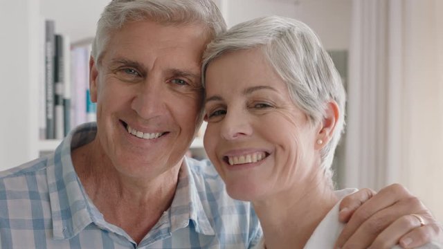portrait happy old couple smiling enjoying retirement together sharing romantic anniversary embracing at home 4k footage