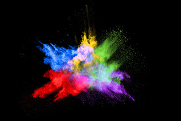 abstract colored dust explosion on a black background.abstract powder splatted background,Freeze motion of color powder exploding/throwing color powder, multicolored glitter texture.