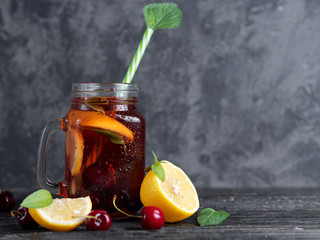 Red summer lemonade with cherry lemon and mint