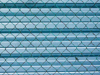 iron grid on the background of an iron fence
