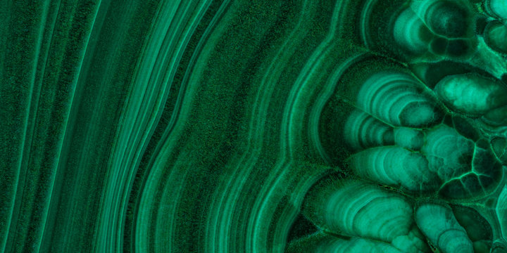 The green malachite. An ornamental stone. Photo texture. Macro.