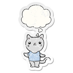 cartoon cat and thought bubble as a distressed worn sticker
