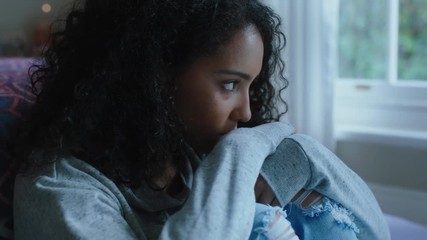 sad teenage girl crying at home feeling alone depressed teen thinking of emotional break up sitting in bedroom - Powered by Adobe