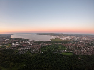 Obraz premium Colorful sunset at Cave Hill Country Park Belfast, Northern Ireland. Aerial view on City and hills 