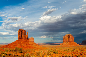 The famous Merrick and Mittens Buttes from monument valley basking in the Light of the setting sun.