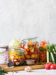 Cooking pickled vegetables. Salting various vegetables in glass jars for long-term storage....