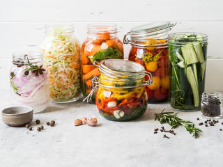 Pickled vegetables. Salting various vegetables in glass jars for long-term storage. Preserves...