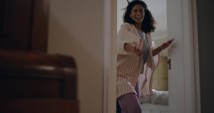 happy little boy chasing mother with teddy bear playing catch running through house mom enjoying fun game with child enjoying weekend morning together 4k footage