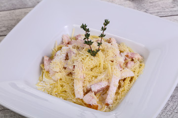 Pasta carbonara with ham and cheese