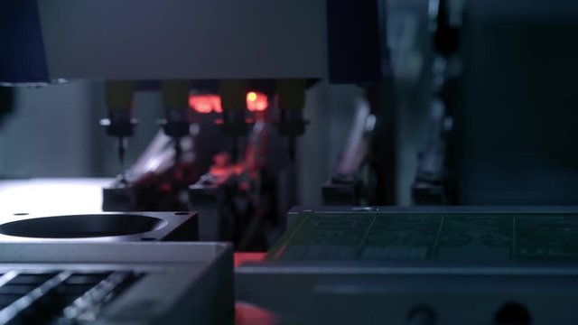 Electronic circuit board production. Automated Circut Board machine Produces Printed digital electronic board. Electronics contract manufacturing. Manufacture of electronic chips. High-tech.