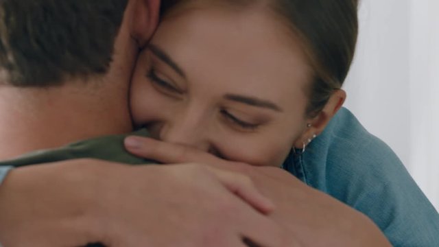 happy couple hugging excited woman embracing boyfriend enjoying romantic relationship at home celebrating good news 4k