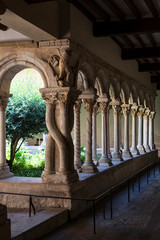 View of the aligned colons of the cloister of the Aix-en-Provence cathedral. France 2019.