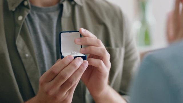 happy couple marriage proposal young man in love proposing to girlfriend enjoying romantic surprise engagement ring hugging boyfriend smiling excited 4k