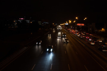 Fototapeta na wymiar Night road with car light trails