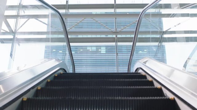 pov empty escalator staircase moving up in airport urban metro travel corporate ladder concept 4k footage