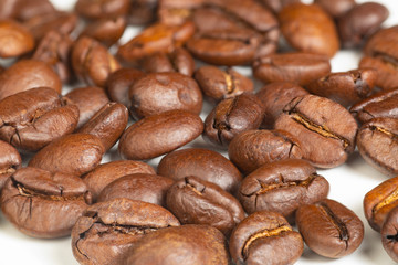 Roasted coffee beans on a white background
