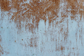 Rusty metal texture with scratches and cracks. paint traces. Blue and dirty orange colors. Copy space
