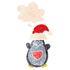 cute christmas penguin and thought bubble in retro textured style