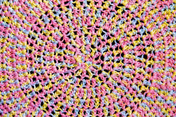 Bright knitted texture. Melange yarn in colorful shades. Cotton yarn.