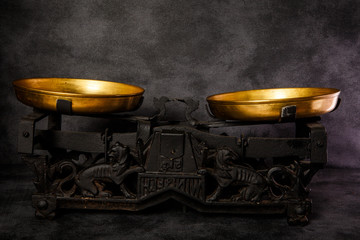 vintage antiquarian scales with two golden bowls