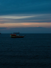 Naklejka premium boat in the sea