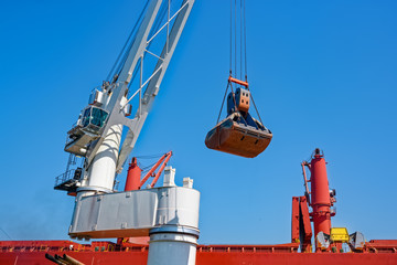 Floating Crane Transhipper with grab feeding system to cater to bauxite ore transhipment operations...