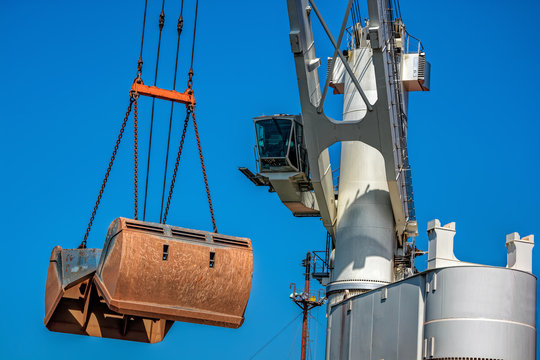 Floating Crane Transhipper with grab feeding system to cater to bauxite ore transhipment operations from barges at outer anchorage of Kamsar, Guinea.