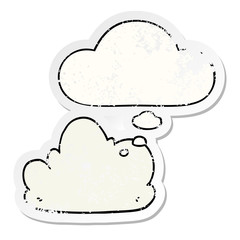 cartoon cloud and thought bubble as a distressed worn sticker