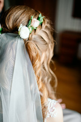 Fototapeta premium Portrait of attractive young woman with beautiful hairstyle and stylish hair accessory, rear view