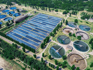 Modern wastewater treatment plant with round ponds for recycle dirty sewage water, aerial view