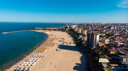 Aerial view of public beach in Constanta, popular tourist place and resort on black sea in a Romania. Also, in constanta is placed largest harbor in Romania.