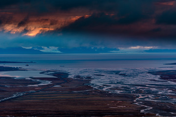 Fototapeta premium View over beautiful Adventdalen from above coal mine number 7, sunset, the arctic tundra of Svalbard or Spitsbergen, northern Norway