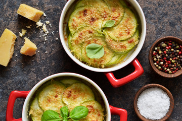 Delicious summer dish with zucchini, cheese and bechamel sauce on an eton background.