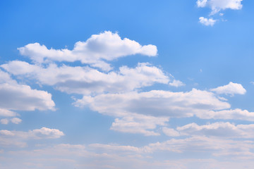 Cloudy sky in clear weather. Cumulus cloud on a sunny winter day. White clouds against a blue sky.