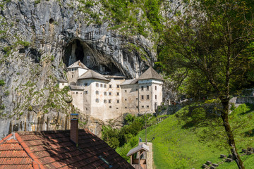 Famous castle of Predjama built into a cave in mountain in Slovenia