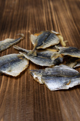 Salted fish lying on a wooden table