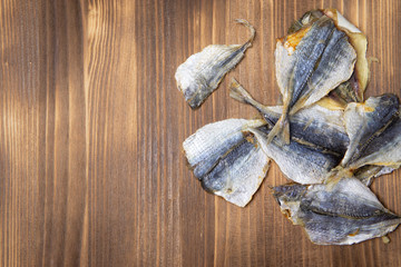 Salted fish lying on a wooden table