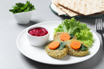 Plate of traditional Passover (Pesach) gefilte fish  on light background