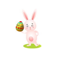 Cute happy easter rabbit on green grass, take colorful egg