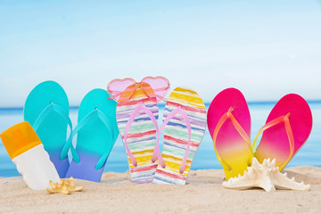 Fototapeta na wymiar Sandy beach with different beach accessories near sea. Summer vacation