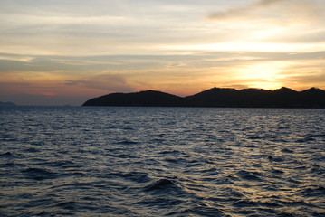 Wonderful sunset over the mountains by the sea