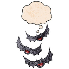 cartoon vampire bats and thought bubble in grunge texture pattern style