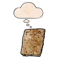 cartoon biscuit and thought bubble in grunge texture pattern style