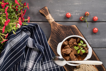Beef meat stew in ceramic pot.