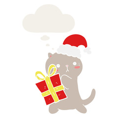 cute cartoon cat carrying christmas present and thought bubble in retro style