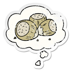 cartoon hazelnuts and thought bubble as a distressed worn sticker